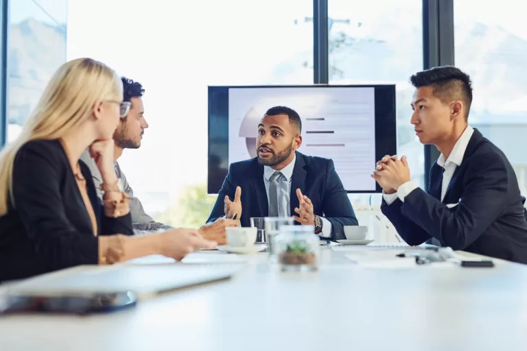 Shot of a group of young businesspeople having a meeting in the boardroom of a modern office